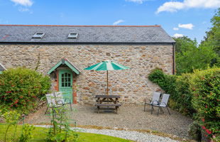 Patio with garden furniture at the rear of Lavender Cottage